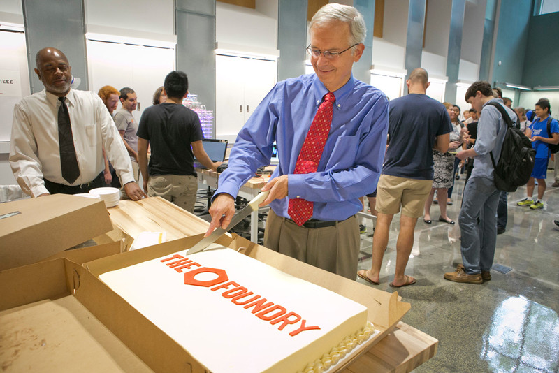 Dr. Truskey cutting the cake to celebrate the opening of The Foundry on Sept. 3, 2015